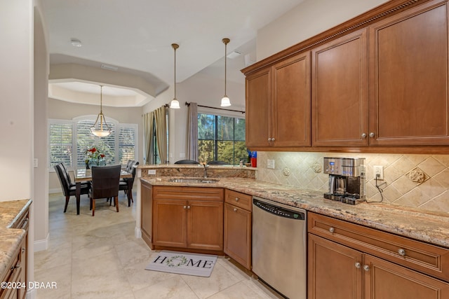 kitchen with tasteful backsplash, stainless steel dishwasher, decorative light fixtures, and plenty of natural light