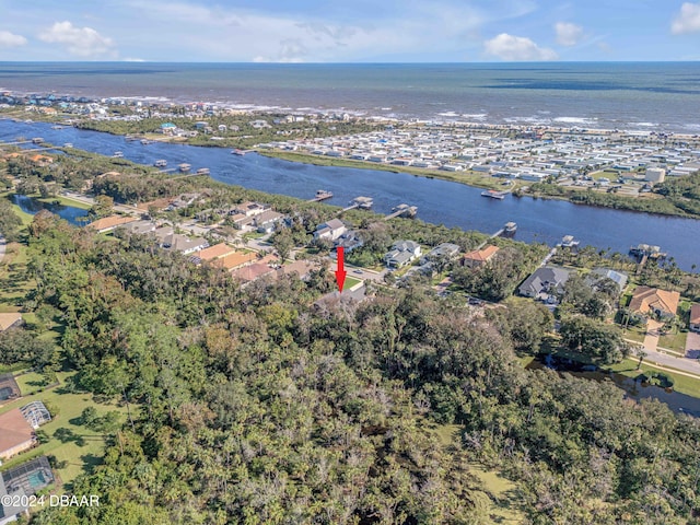 birds eye view of property featuring a water view