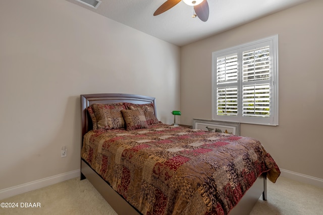 bedroom featuring ceiling fan and light colored carpet