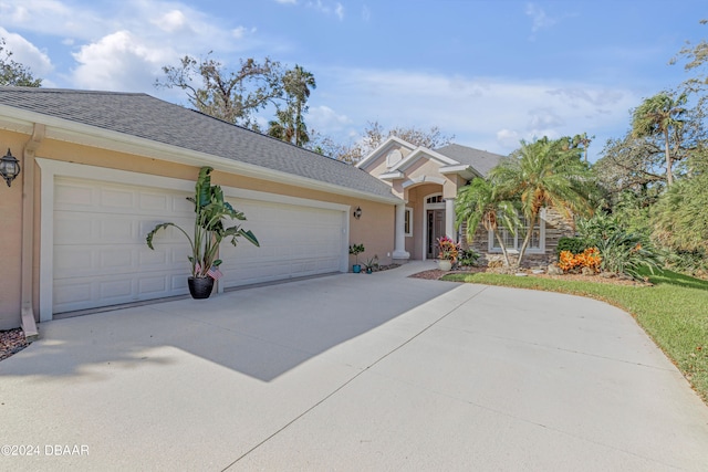 view of front of home with a garage