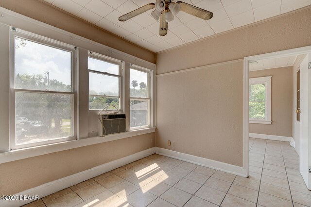 634 Aberdeen St, Daytona Beach, FL 32114 - spare room with light tile patterned floors, a ceiling fan, baseboards, and cooling unit