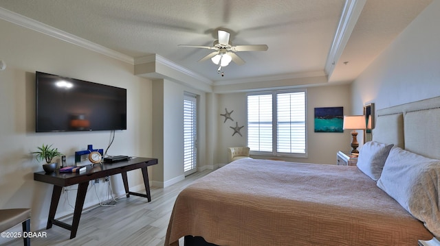 2403 S Atlantic Ave Unit 605, Daytona Beach, FL 32118 - bedroom with light wood-style flooring, ornamental molding, baseboards, and ceiling fan