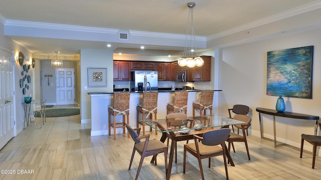 2403 S Atlantic Ave Unit 605, Daytona Beach, FL 32118 - dining area featuring ornamental molding, baseboards, and recessed lighting