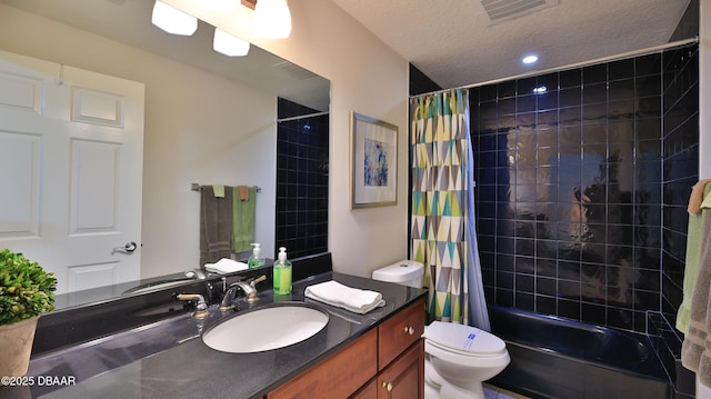 2403 S Atlantic Ave Unit 605, Daytona Beach, FL 32118 - bathroom with vanity, shower / tub combo, toilet, recessed lighting, and a textured ceiling