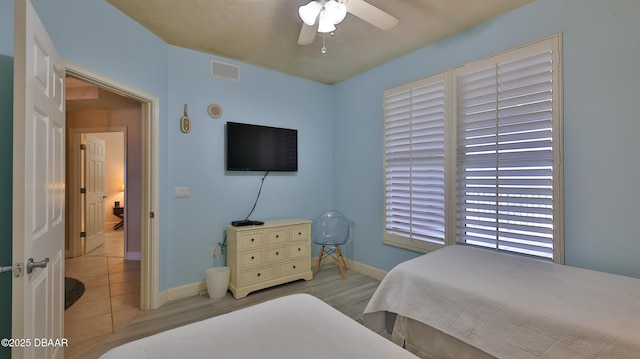 2403 S Atlantic Ave Unit 605, Daytona Beach, FL 32118 - bedroom featuring baseboards and ceiling fan