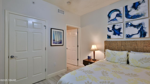 2403 S Atlantic Ave Unit 605, Daytona Beach, FL 32118 - bedroom featuring baseboards and light wood finished floors