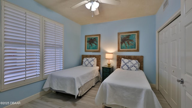 2403 S Atlantic Ave Unit 605, Daytona Beach, FL 32118 - bedroom featuring baseboards, a closet, and a ceiling fan