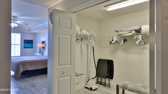 2403 S Atlantic Ave Unit 605, Daytona Beach, FL 32118 - spacious closet with light wood finished floors, ceiling fan, and a tray ceiling