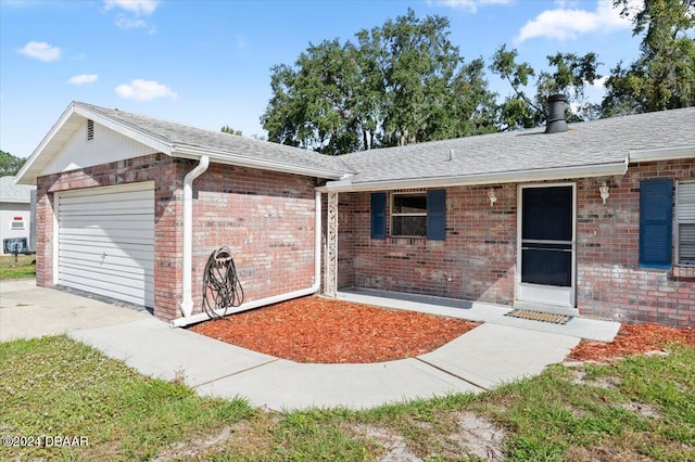 single story home with a garage