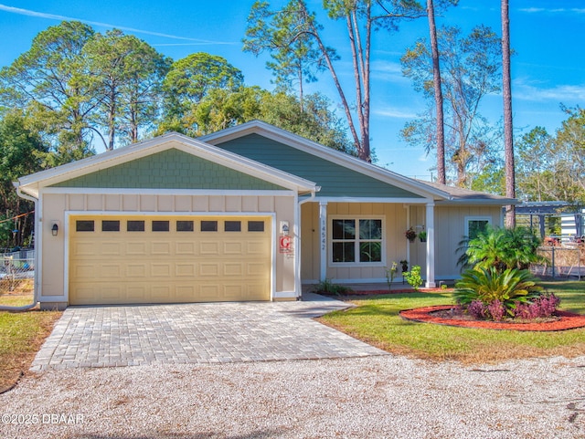 ranch-style house featuring a garage