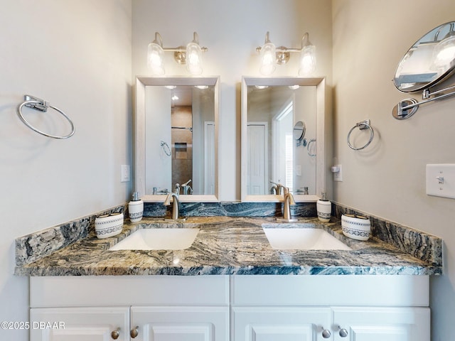 bathroom featuring vanity and a shower