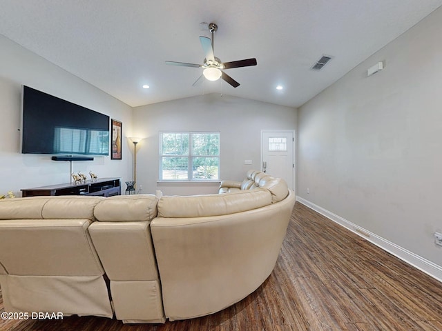 living room featuring ceiling fan, hardwood / wood-style floors, and lofted ceiling