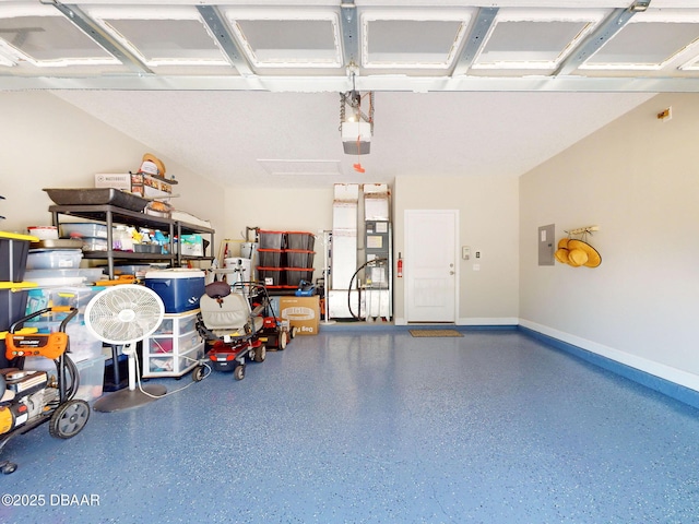 garage with a garage door opener and electric panel