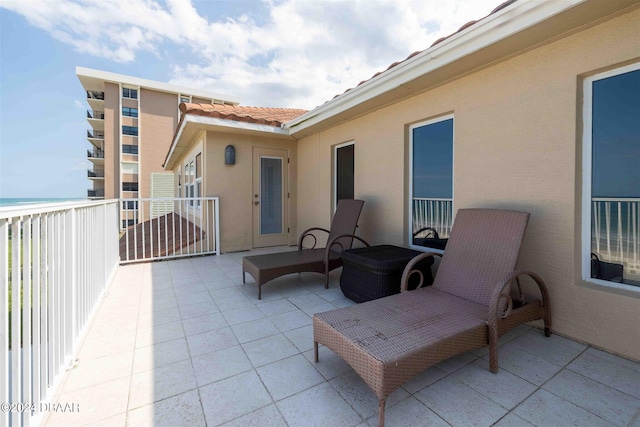 view of patio featuring a water view