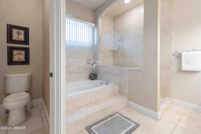 bathroom with tile patterned flooring, toilet, and independent shower and bath