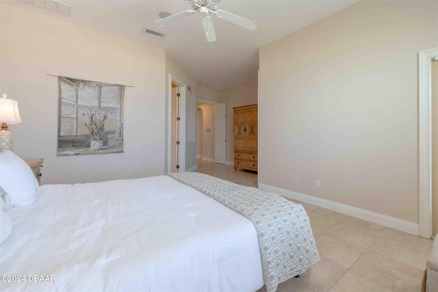 bedroom with light tile patterned flooring, ceiling fan, and lofted ceiling