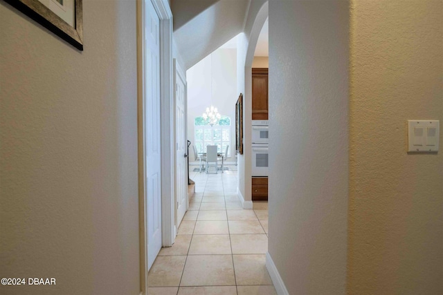 corridor with light tile patterned floors