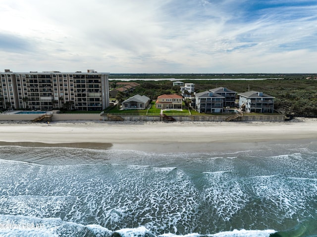 bird's eye view with a view of the beach and a water view