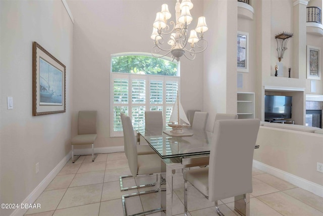 tiled dining room featuring an inviting chandelier