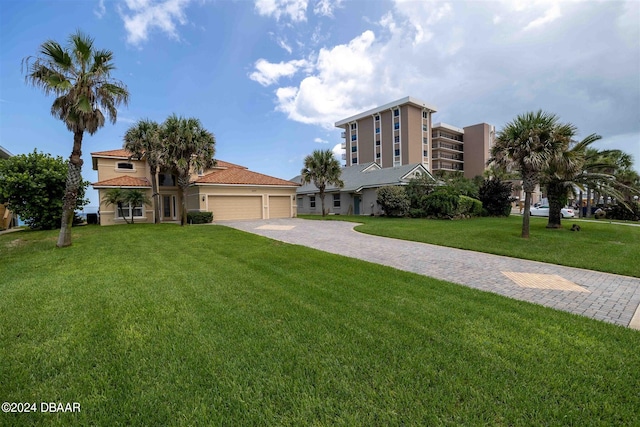 view of front of home featuring a garage and a front yard