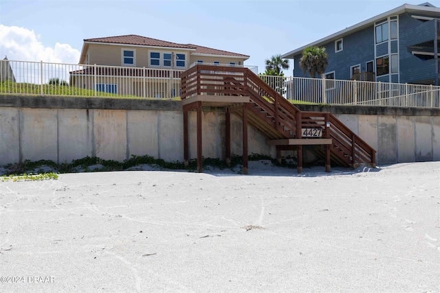 back of house with a wooden deck