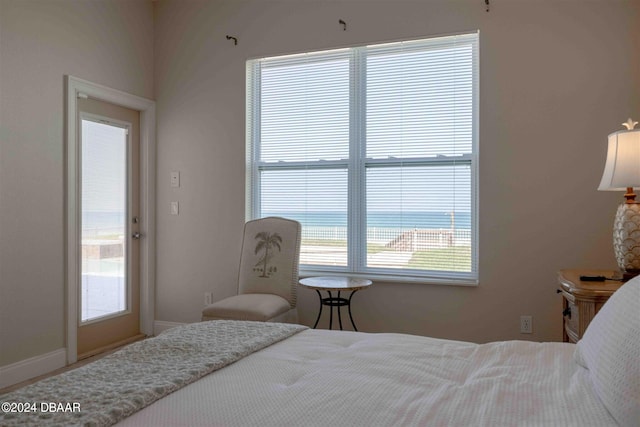 bedroom featuring a water view