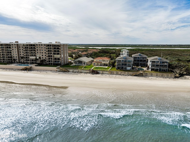 bird's eye view with a water view and a view of the beach