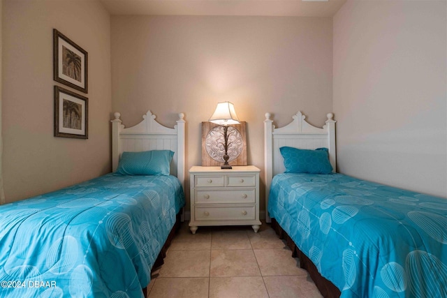 bedroom featuring light tile patterned flooring