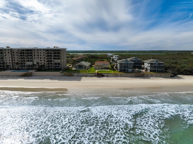 bird's eye view featuring a view of the beach and a water view