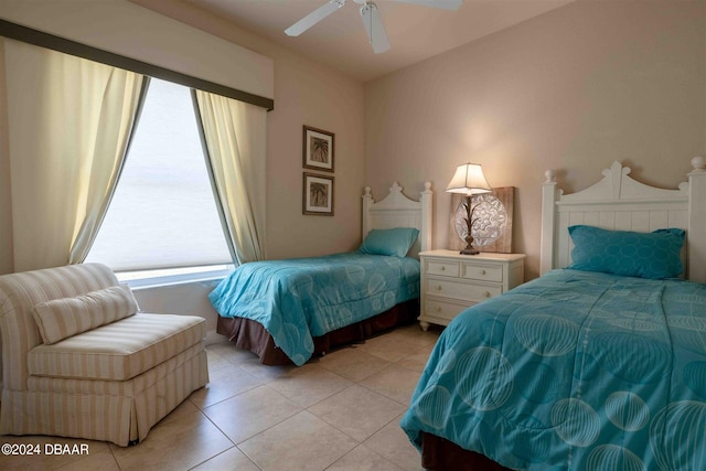 bedroom featuring ceiling fan and light tile patterned floors