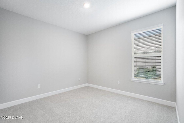 unfurnished room with carpet