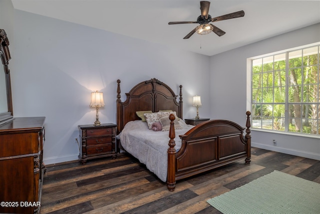bedroom featuring dark wood-type flooring and baseboards