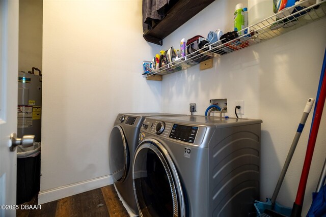 760 Trophy Hunter Trl, New Smyrna Beach, FL 32168 - clothes washing area featuring independent washer and dryer, laundry area, water heater, dark wood-style floors, and baseboards