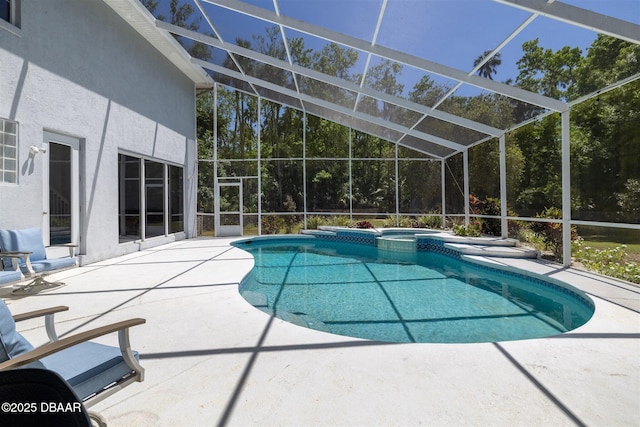 760 Trophy Hunter Trl, New Smyrna Beach, FL 32168 - view of swimming pool featuring a pool with connected hot tub, a patio area, and glass enclosure
