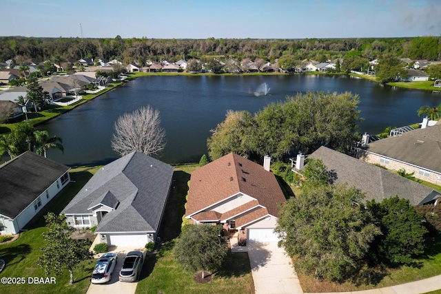 bird's eye view featuring a water view and a residential view