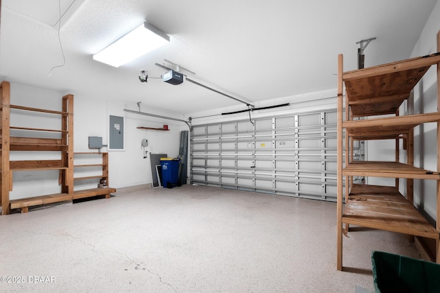 garage with electric panel and a garage door opener