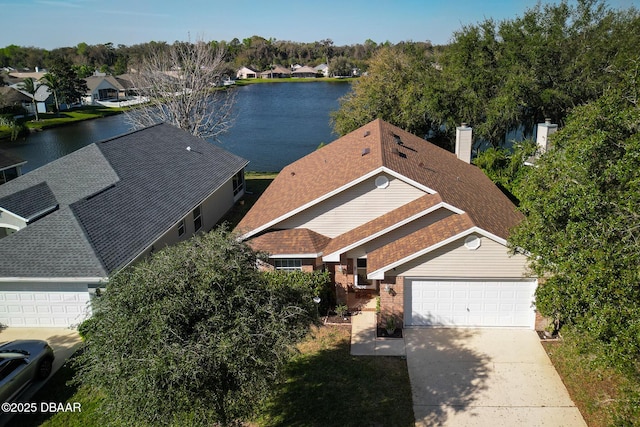 bird's eye view featuring a residential view and a water view