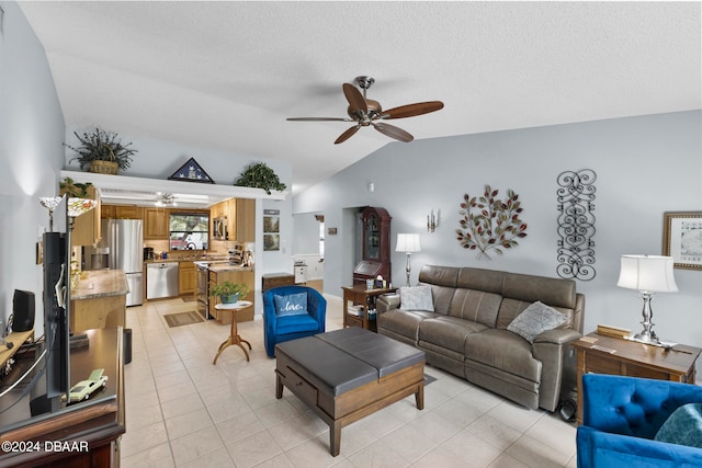 tiled living room with ceiling fan and vaulted ceiling