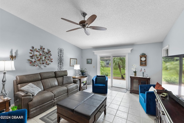 tiled living room featuring ceiling fan and a textured ceiling