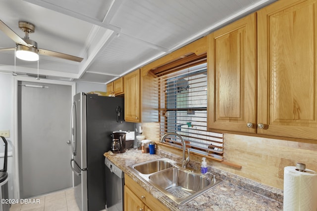 kitchen with dishwasher, sink, and light tile patterned floors