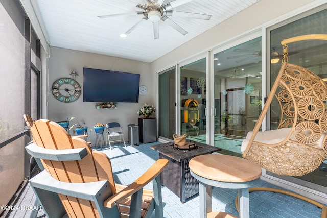 sunroom / solarium with ceiling fan