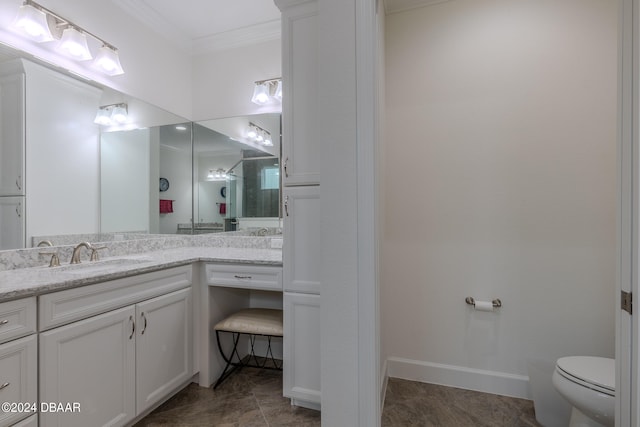 bathroom with tile patterned flooring, vanity, toilet, and ornamental molding