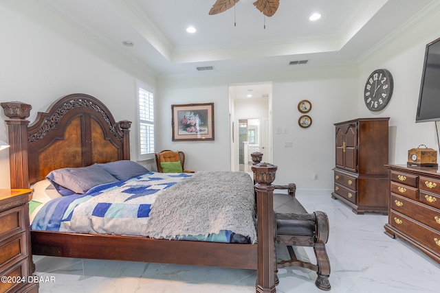 bedroom with ceiling fan, a raised ceiling, and crown molding