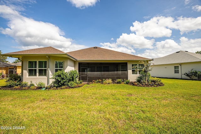 1124 Sea Shell Ct, Daytona Beach, FL 32124 - back of property with stucco siding, a sunroom, a yard, and a shingled roof
