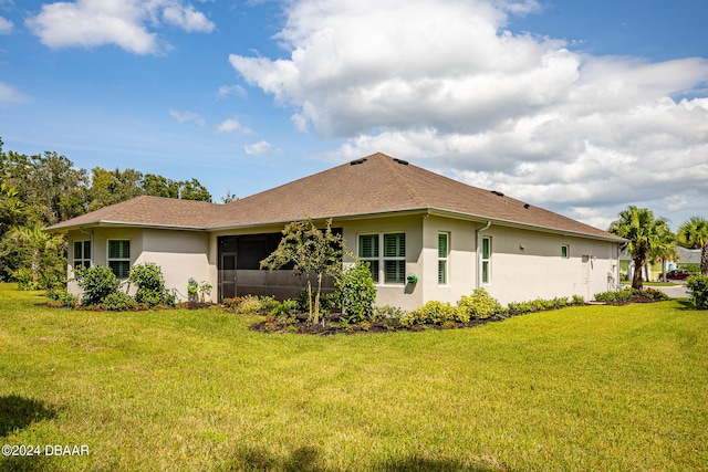 view of home's exterior with a yard