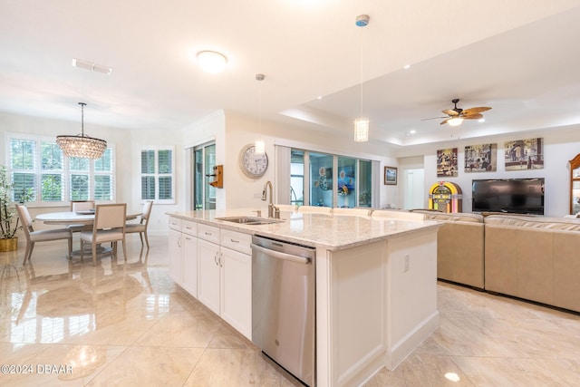 1124 Sea Shell Ct, Daytona Beach, FL 32124 - kitchen with dishwasher, a sink, a center island with sink, light marble finish floors, and light stone counters