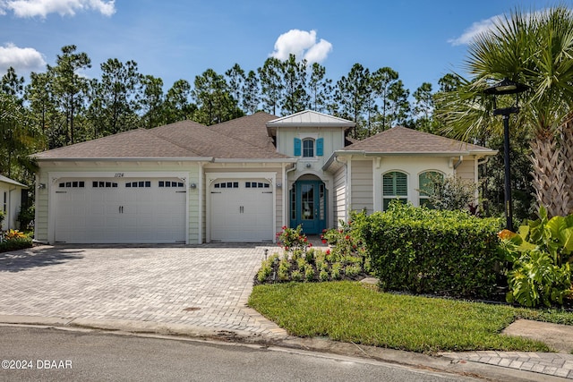 1124 Sea Shell Ct, Daytona Beach, FL 32124 - view of front of property with an attached garage and decorative driveway