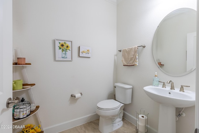 1124 Sea Shell Ct, Daytona Beach, FL 32124 - bathroom featuring toilet, baseboards, and a sink
