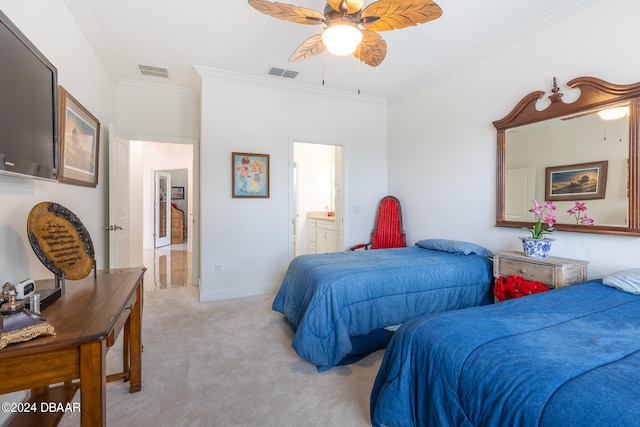 carpeted bedroom with ensuite bathroom, ceiling fan, and crown molding