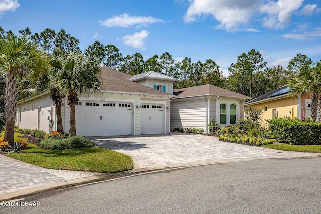 1124 Sea Shell Ct, Daytona Beach, FL 32124 - view of front facade with an attached garage and decorative driveway